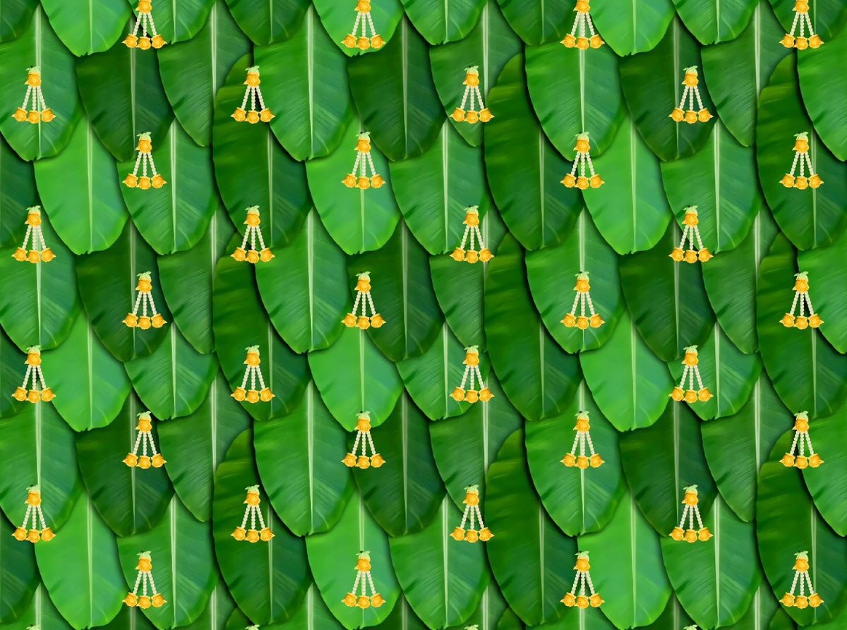 South Indian Backdrop: Texture of Banana leaf with yellow rose tassel